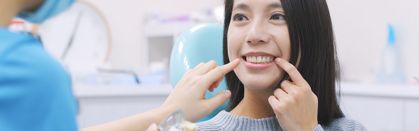 A woman talk with a dentist about having dental implants